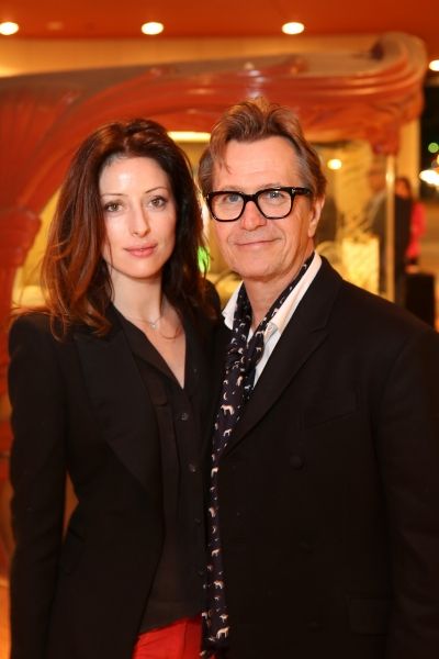 From left, Alexandra Edenborough and actor Gary Oldman pose during the arrivals for t Photo