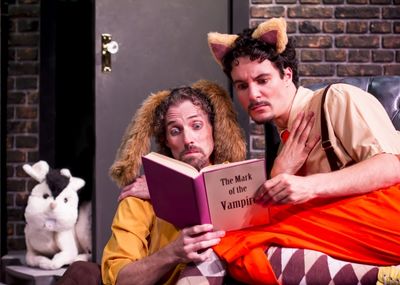 Harold the dog (Stephen Hurst) and Chester the Cat (Braden Hunt) read up on the new r Photo
