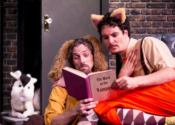 Harold the dog (Stephen Hurst) and Chester the Cat (Braden Hunt) read up on the new r Photo