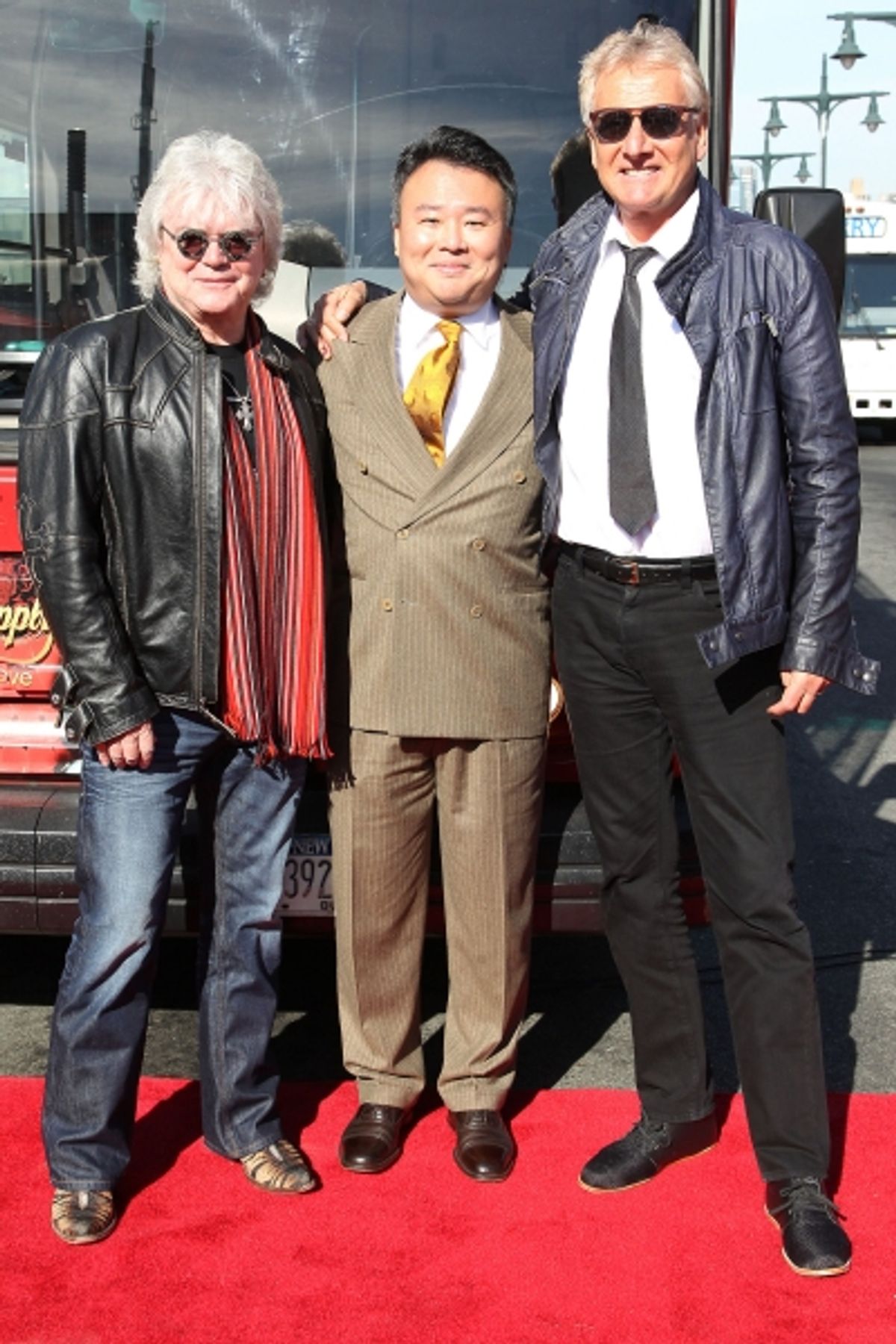 Russell Hitchcock of Air Supply, David Chien of Gray Line New York, and Graham Russell of Air Supply at 