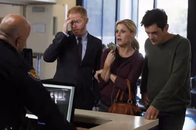 JESSE TYLER FERGUSON, JULIE BOWEN, TY BURRELL    Photo
