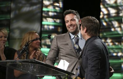 From left, Ben Affleck, Career Achievement Award winner and presenter Jeremy Renner d Photo