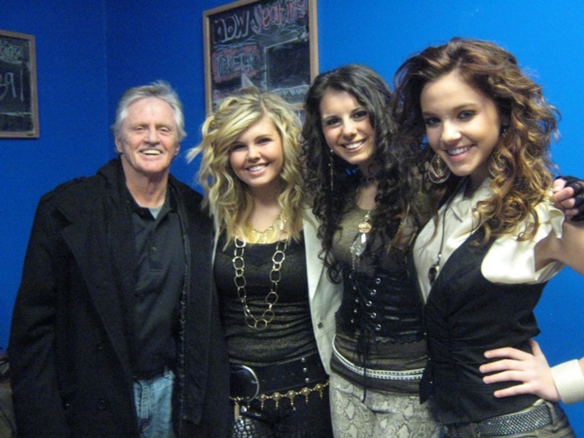 Play It Forward founder Gary Burbank with Jetset Getset singers Tori Little, Sadie Loveland and Avery Eliason at 