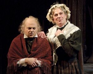 Jeffrey Bean as Ebenezer Scrooge and John Feltch as Mrs. Dilber Photo