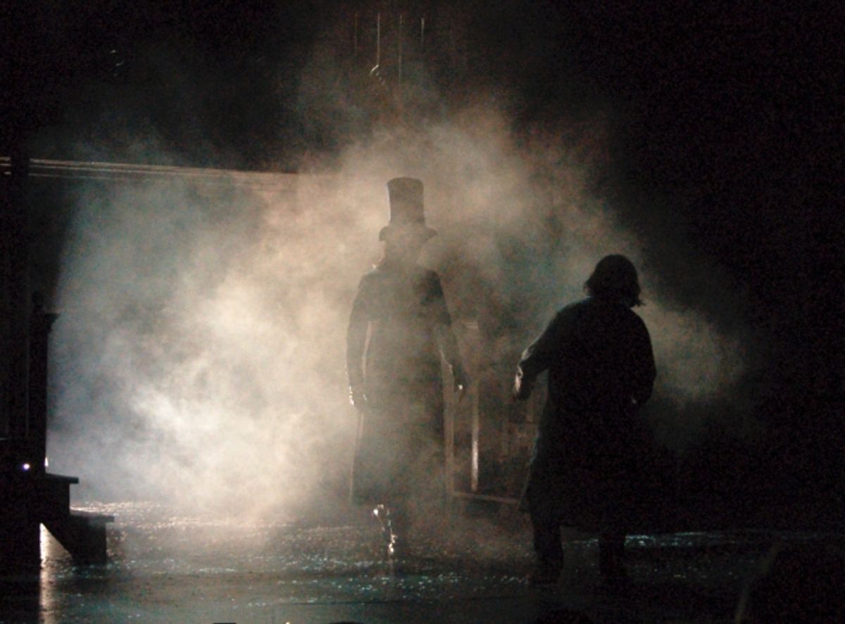 JASON LILES as Spirit of Christmas Future; WILBUR EDWIN HENRY as Ebenezer Scrooge at 