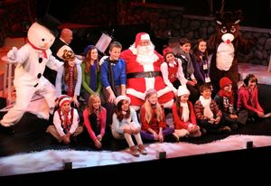 Snowman, Ken Jones as Santa Claus and Rudolph with youth chorus, front row left to ri Photo