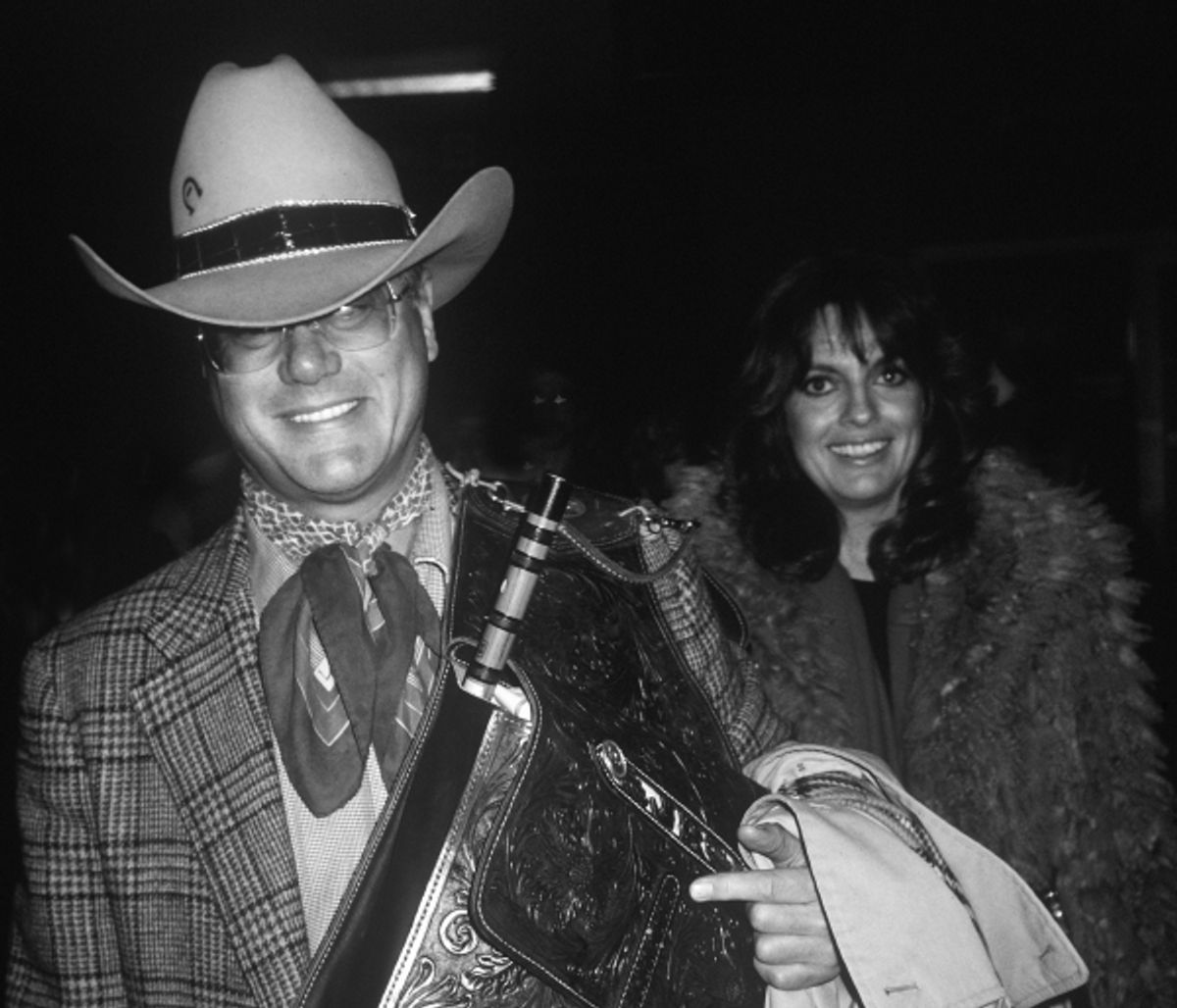 Larry Hagman and Linda Gray at the Kennedy Airport in New York City in 1982.  at 