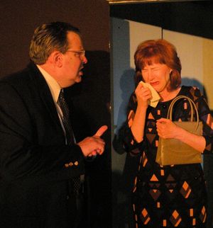 Barney (Bob Maddox) tries to reassure Jeanette (Vicky McCormick)  Photo