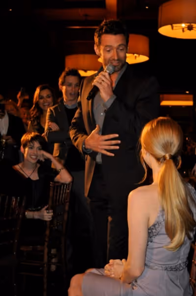 
(center) Hugh Jackman, (partly hidden) Amanda Seyfried, Anne Hathaway, Eddie Redmay Photo