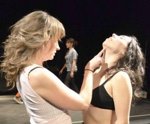 Erin Leddy and Maesie Speer are coached through a seduction. Photo by Kelli Penningto Photo