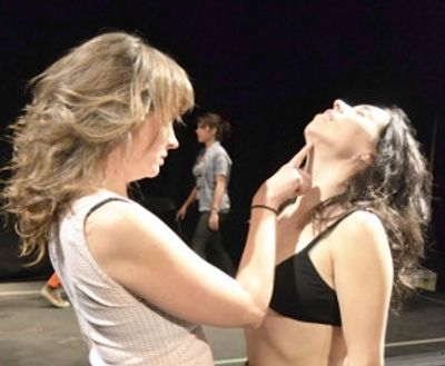 Erin Leddy and Maesie Speer are coached through a seduction. Photo by Kelli Penningto Photo