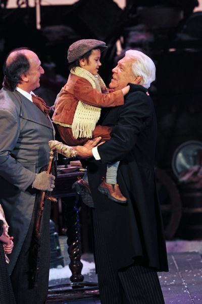 Jeffrey Howell as Bob Cratchit, Simon Nigam as Tiny Tim and Tom Atkins as Scrooge Photo