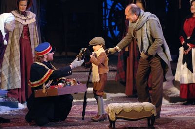 Jonathan Visser as Train Vendor, Simon Nigam as Tiny Tim and Jeffrey Howell as Bob Cr Photo