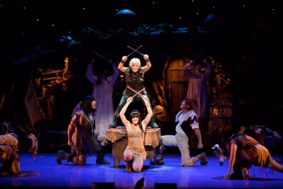Cathy Rigby as Peter Pan, Jenna Wright as Tiger Lilly, and cast dance during "Ugg-a-W Photo