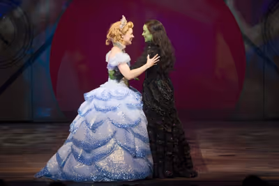 Gina Beck as Glinda and Louise Dearman as Elphaba Photo