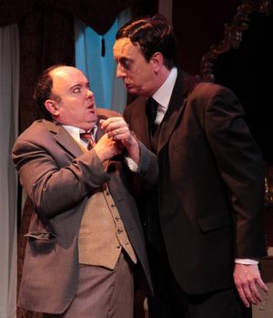 Jonathan Brewster (Jeff Stockberger), right, demands that plastic surgeon Dr. Einstein (Eddie Curry) give him a new face. @ BroadwayWorld Jonathan Brewster (Jeff Stockberger), right, demands that plastic surgeon Dr. Einstei Photo