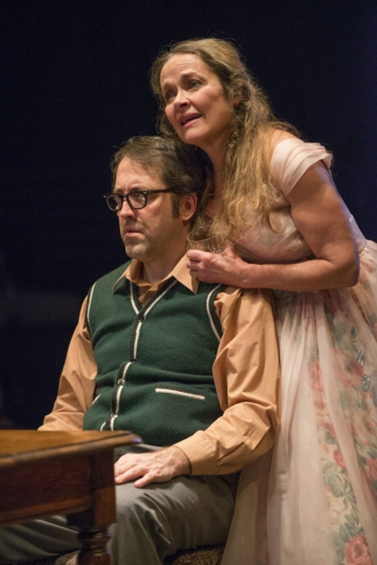 (right to left) Meg (ensemble member Moira Harris) sings a tune for Stanley (ensemble member Ian Barford) on his birthday. at 