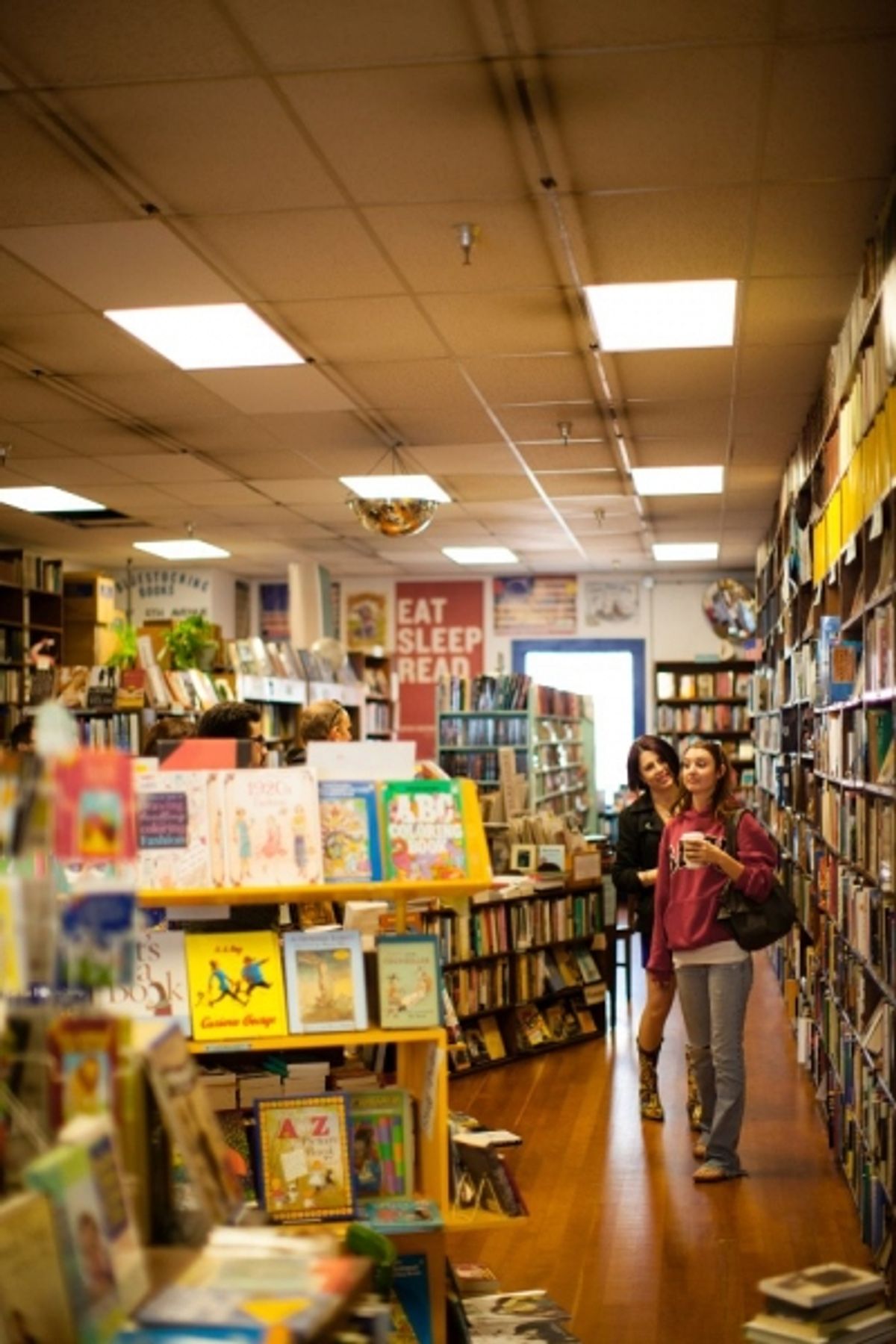 Whitney Shay and Kathryn Byrd shop for reading material. at 
