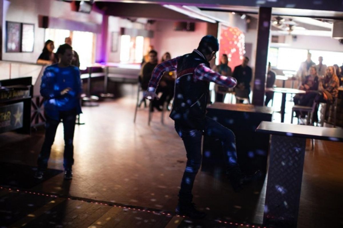 Shaun Tuazon as Chris and Justin Warren Martin as Alex cut loose on the dance floor! at 