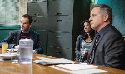 "Possibility Two"--  Sherlock (Jonny Lee Miller, right), Gregson (Aidan Quinn, left)  Photo