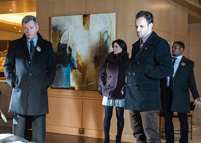 "Possibility Two"--   Sherlock (Jonny Lee Miller, right), Gregson (Aidan Quinn, left) Photo