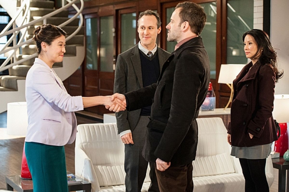 'Possibility Two'--  Sherlock (Jonny Lee Miller) tries to teach Joan (Lucy Liu) his deductive skills by sending her to a suspicious dry cleaning establishment, on ELEMENTARY, on a Thursday, Feb. 21 on the CBS Television Network. Photo: Jojo WhildenÃ'â€šÃ‚ at 