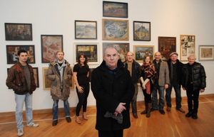 Director Max Roberts (centre) pictured with the full cast of 'The Pitman Painters' at Photo