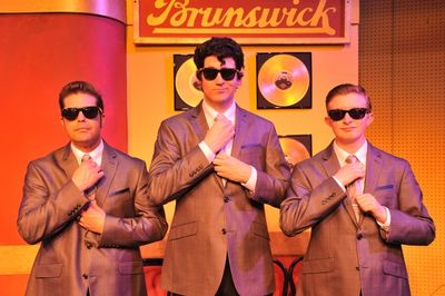 Ralph Krumins as Buddy Holly (center), drummer Joaquin David (right) and bassist Skee Photo