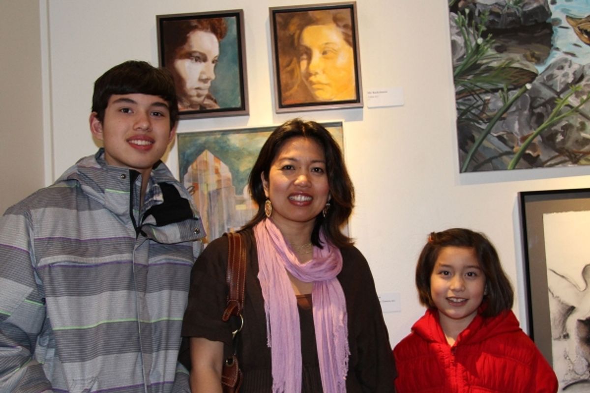 Painter Mic Boekelmann, center, of Princeton, is pictured with her paintings and her children, who served as her models. at 2013 Mercer County Artist Award Winners Announced in New Jersey