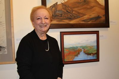 Margaret Miller, of Lawrenceville, is pictured with "Autumn Tide," winner of a Mercer Photo