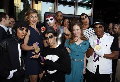Rowers Erin Cafaro (2nd L) and Mary Whipple (3rd R) pose with Cirque du Soleil Photo