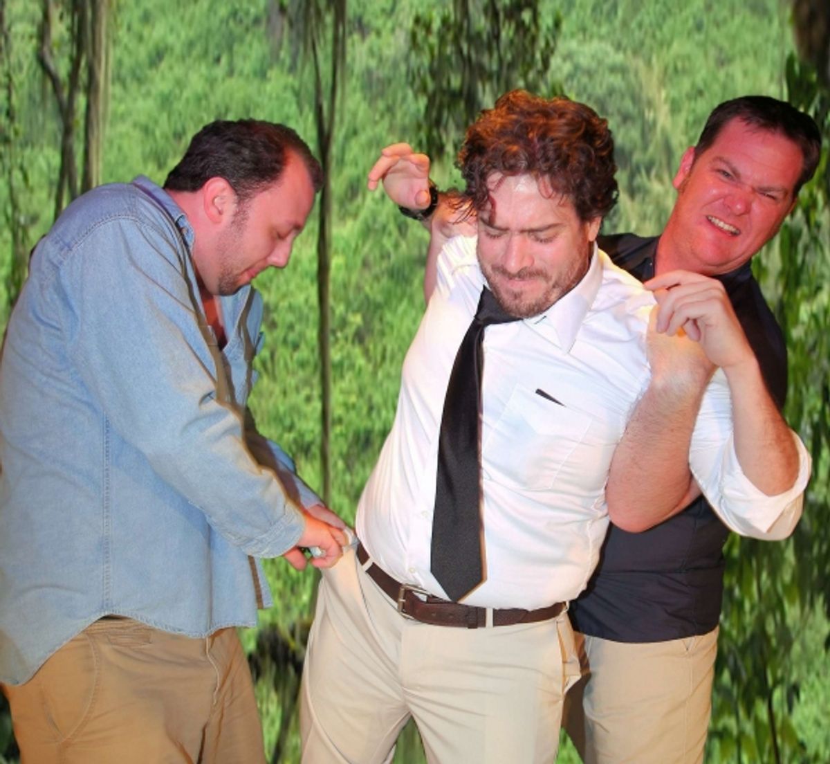 The newly sent tour guide,(Justin Holloway) takes the bus keys away from Rev. Shannon (Scott McWhirter) as the bus driver (Jason Tull) holds the Rev. still. at 