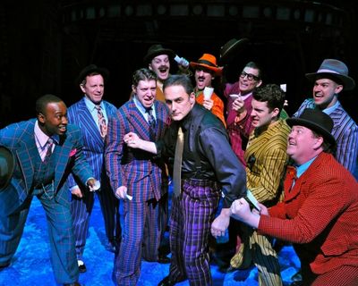 Gary Lynch (center, as Sky Masterson) and ensemble perform "Luck Be A Lady."Allie Sch Photo