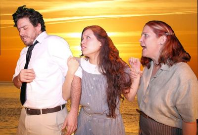 The Rev. Shannon (Scott McWhirter) is held on to by the love-starved Charlotte (Helen Photo