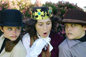 Astuce (Logan Hannig - right) and Trompeur (Savannah Keown - left) advise King Confort (Osric Holt - center) regarding their search for a suitable citizen to execute. Photo credit: Melodie S. Rivers @ BroadwayWorld Astuce (Logan Hannig - right) and Trompeur (Savannah Keown - left) advise King Confor Photo