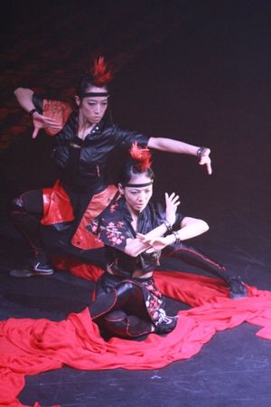 Ai Ikeda as She-Wolf (standing) and Takemi Kitamura as She-Wolf Sister (on floor) @ BroadwayWorld Ai Ikeda as She-Wolf (standing) and Takemi Kitamura as She-Wolf Sister (on floor) Photo