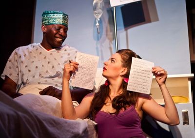 Lionel Gentle as Ambimbola; Amanda Powell as Rozie Photo