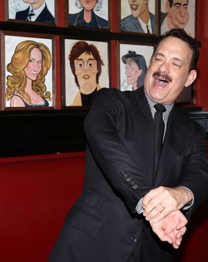 Tom Hanks with wife Rita Wilson caricature behind him @ BroadwayWorld Tom Hanks with wife Rita Wilson caricature behind him Photo