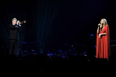 Barbra Streisand performs on stage with Chris Botti
 Photo