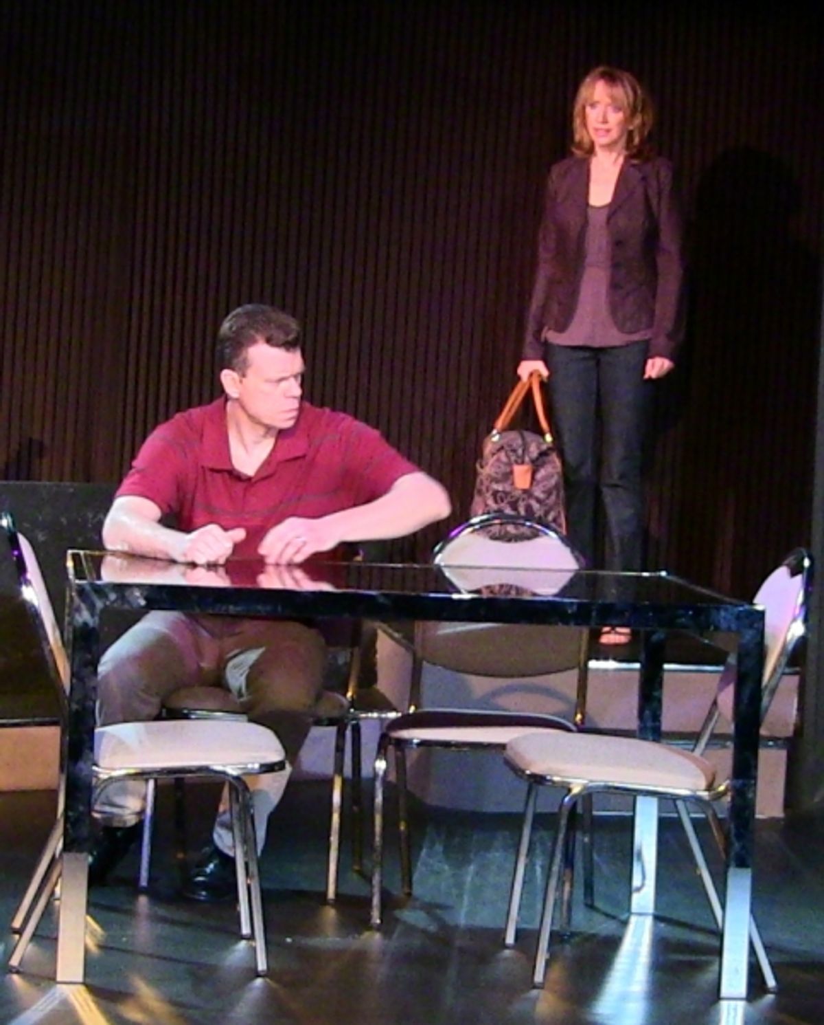 Dan (played by John DeMerell) hears startling news from his wife Diana (played by Diane Hill) at 