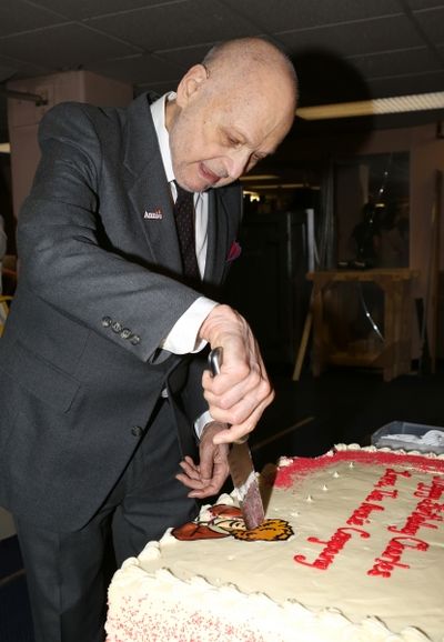Charles Strouse cuts into the ''Annie'' Logo requested by his grandaughter Photo