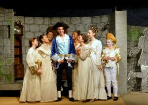 Paysanne (Anthony Olivas) is a hit with the ladies at court (from left) Melana Dix, Tyler Cable, Emilia Zielinski, TaiJonna Boone, HanaLina Woolley, Avalon Silver, and The Chaperone, Miller Vaughn. @ BroadwayWorld Paysanne (Anthony Olivas) is a hit with the ladies at court (from left) Melana Dix, T Photo