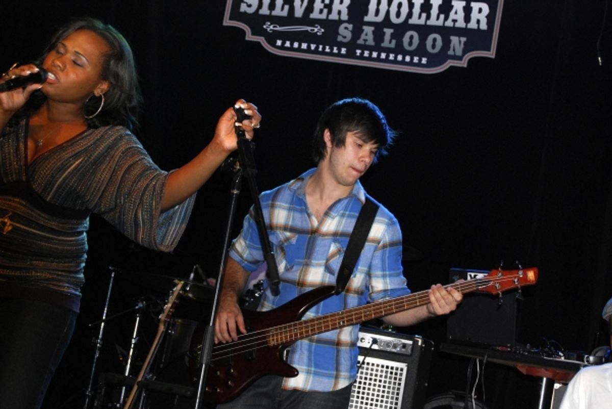 Singer Adrianna Freeman and bass player Theo Hartlett on stage at the Silver Dollar Saloon. at 