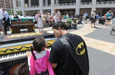 Warren Alvarez and his daughter Delilah, 5, of Queens, enjoy Father''s Day by playing Photo
