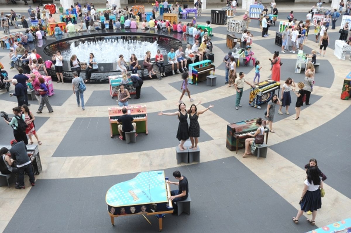Sing for Hope co-founders Monica Yunus, center right, and Camille Zamora, center left, celebrate the conclusion of the Sing for Hope Pianos project at 