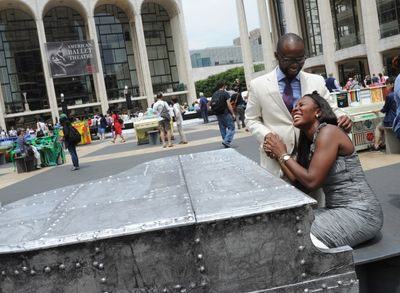 Sangwani, left, and Eghosa Mabhena share a moment at the piano designed by John Varva Photo