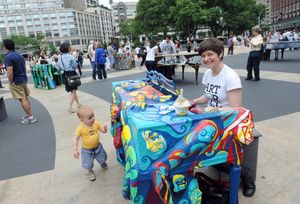 Artist Jessica Browne-White plays the piano she designed, one of the 88 Sing for Hope Photo