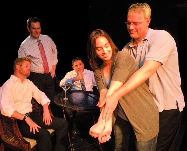 Luisa (Stefani Patch) gets a golf lesson from Brandt (Lance Stodghill) while Hector(J Photo