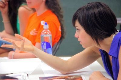 Krysta Rodriguez works with a student
 Photo