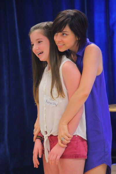 Krysta Rodriguez works with a student
 Photo